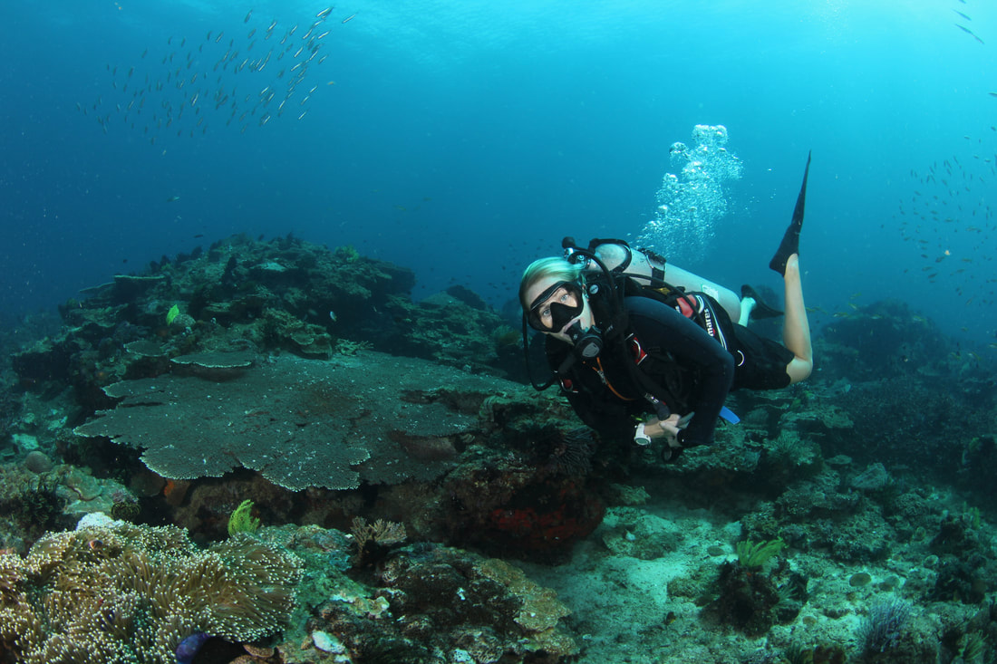 Woman diver at coral reef Kota belud Sabah