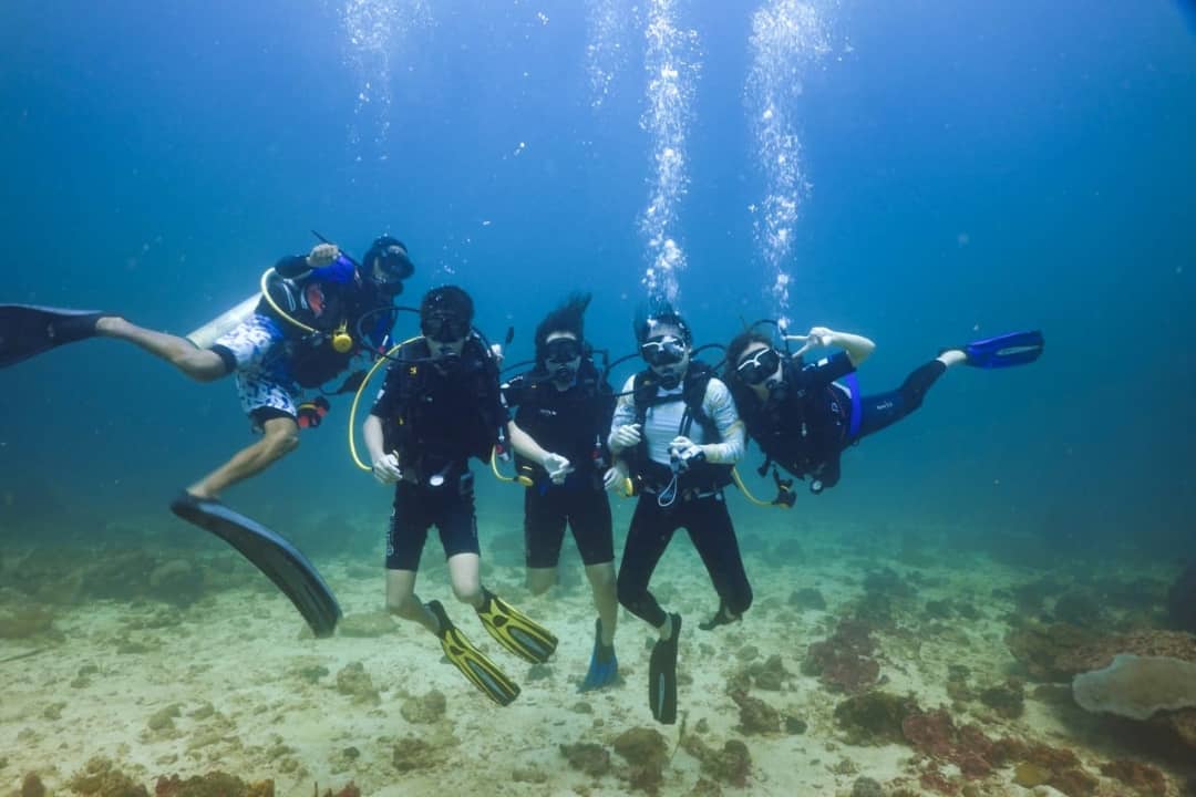Group of scuba divers underwater in Kota Belud Sabah Borneo