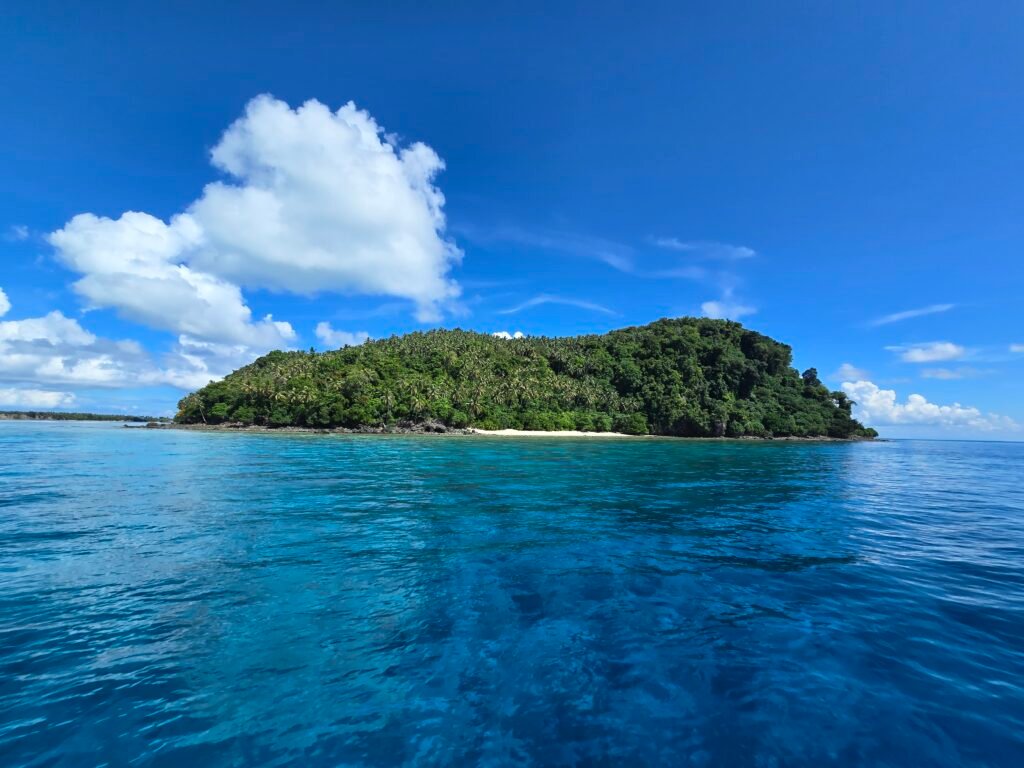 View of Mantabuan island from boat during day trip Semporna