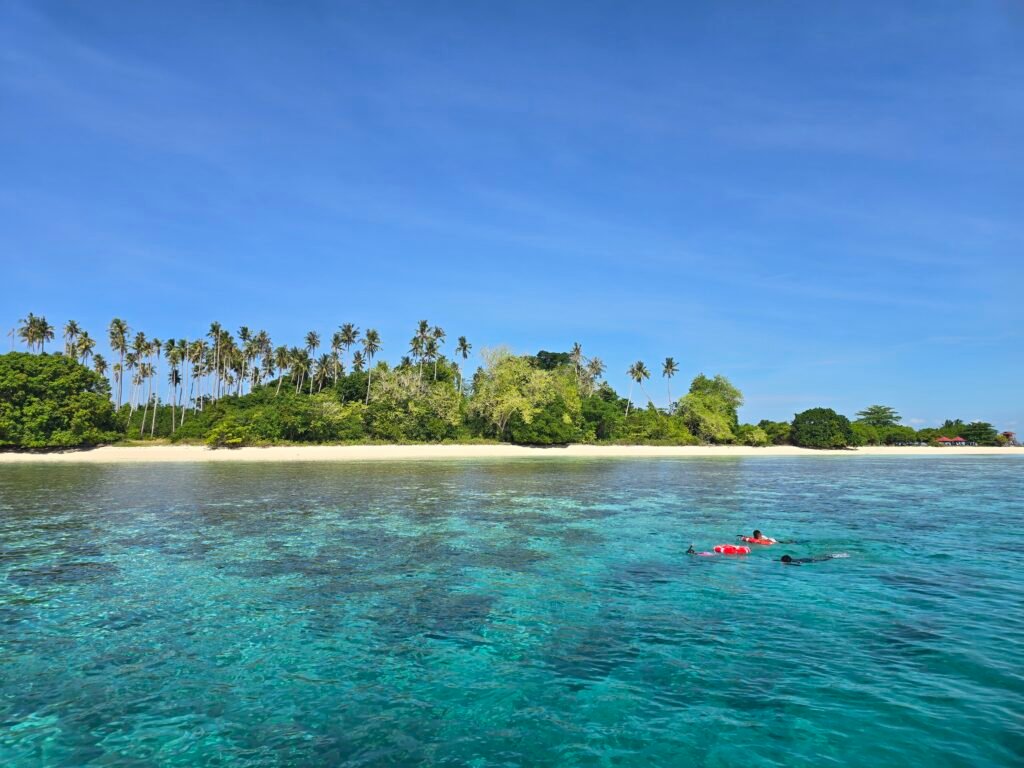 Tourists Snorkeling in Sabah at Sibuan Island, Tun Sakaran Marine Park