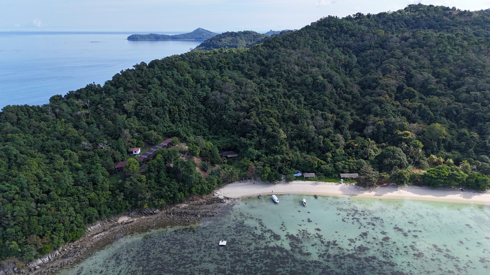 View of bigfin beach resort Kota Belud surrounded by dense jungle and sandy beach
