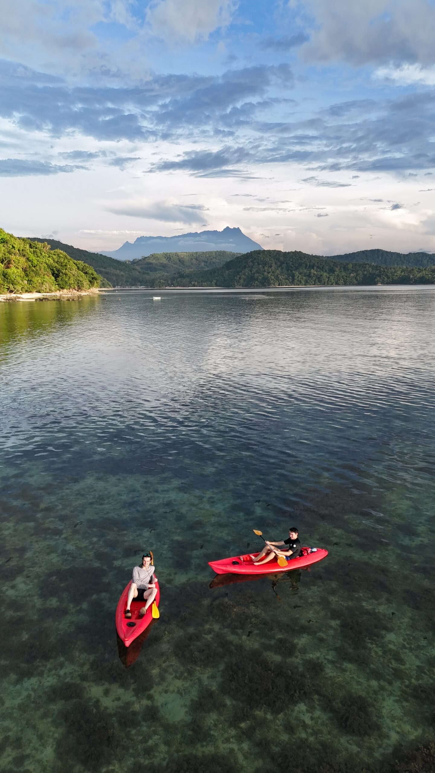 Kayaking and snorkeling in Sabah at Bigfin beach resort, Kota Belud with view of Mount Kinabalu in the distance