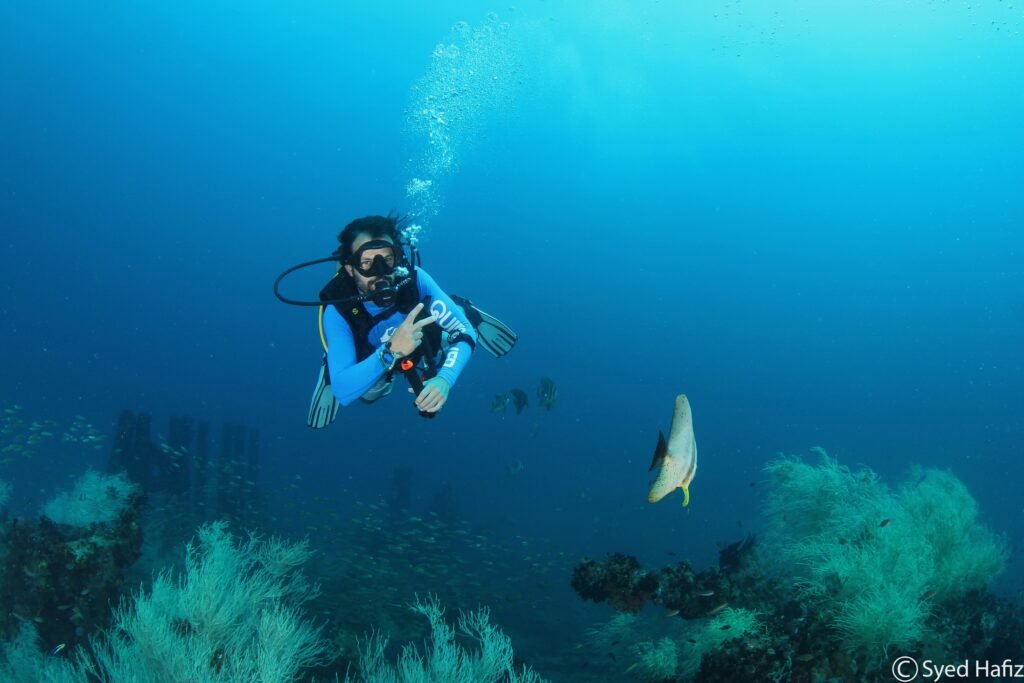 Professional diver during PADI Dive Master course Sabah