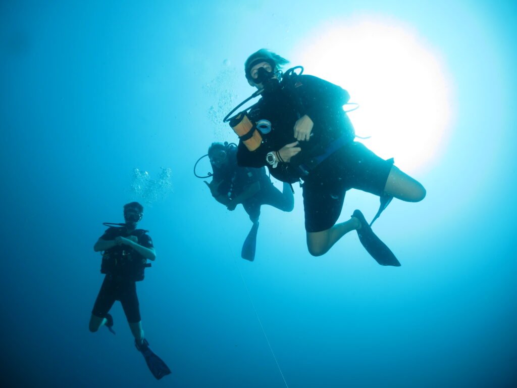 Scuba divers descending during Deep dive in Sabah