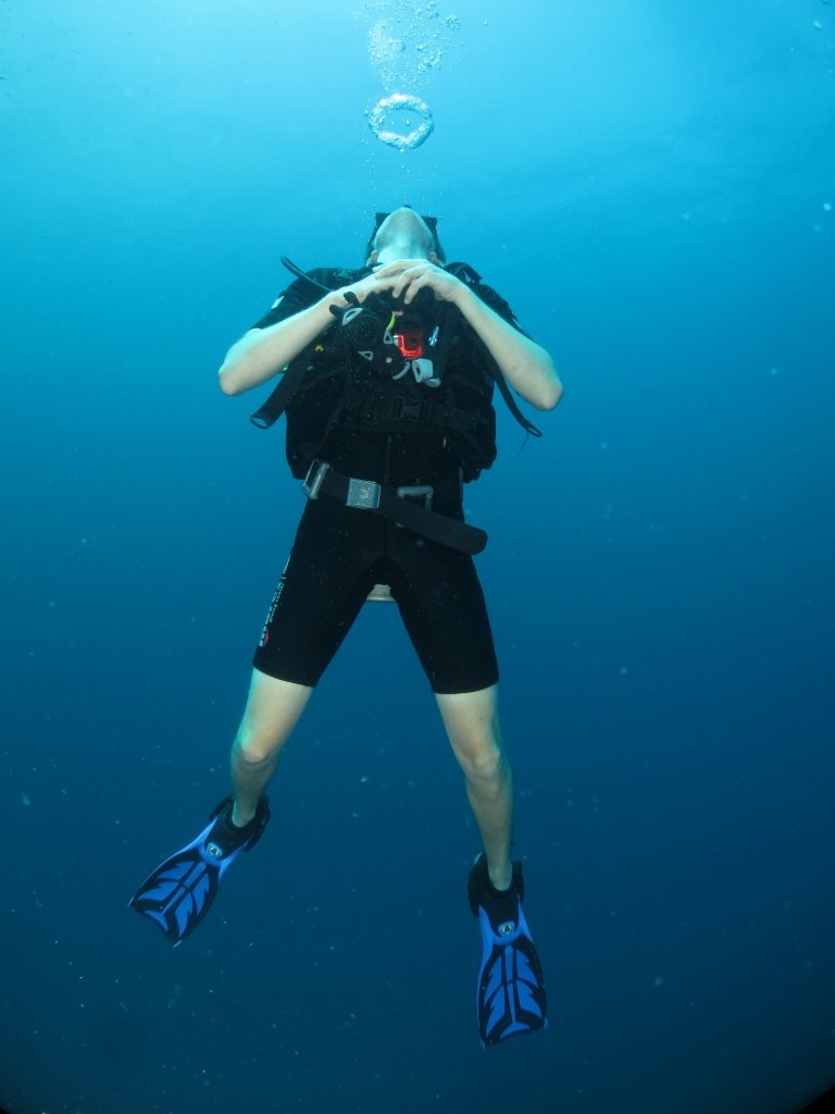 Diver blowing bubble rings underwater during PADI Discover scuba dive